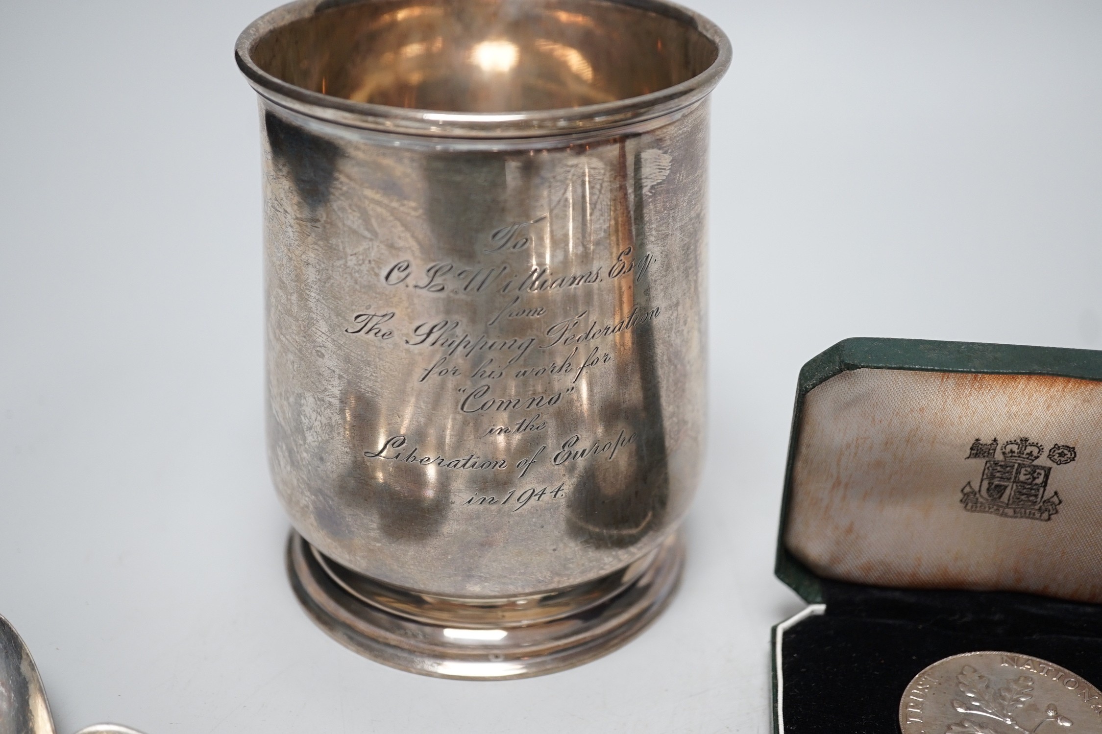 A George VI silver mug, with engraved inscription, James Dixon and Sons, Sheffield, 1943, 11.3cm, together with twelve items of silver flatware including set of six William IV silver fiddle pattern teaspoons, a silver al